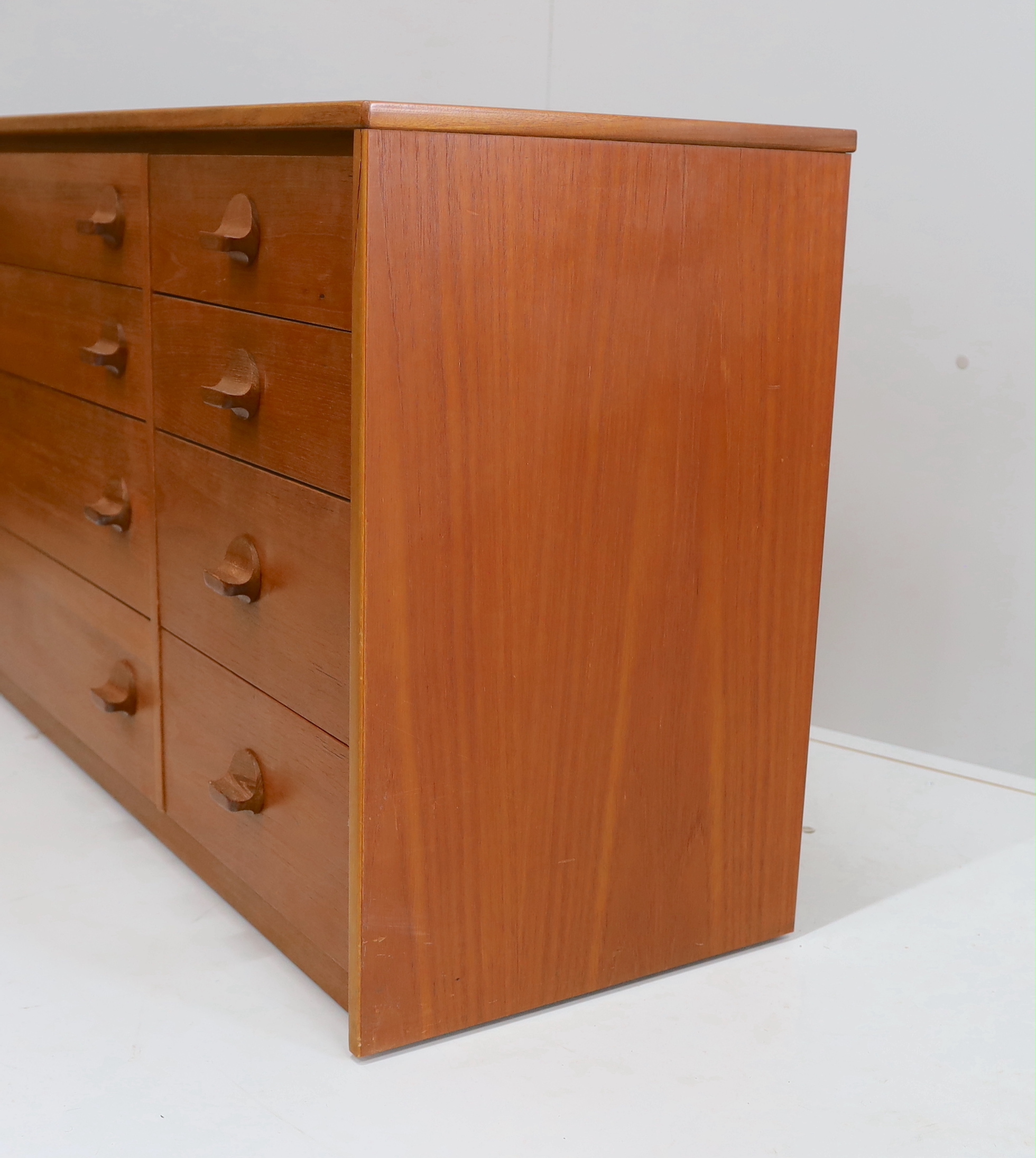 Ron Carter for Stag Furniture - A 'Cantata' teak chest of eight drawers, width 118cm, depth 44cm, height 69cm